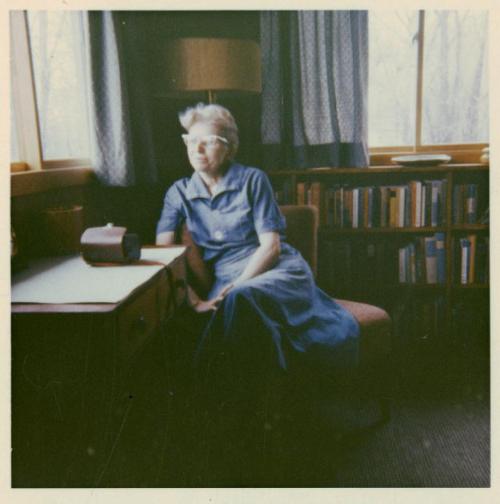 Lorine Niedecker at a writing desk.